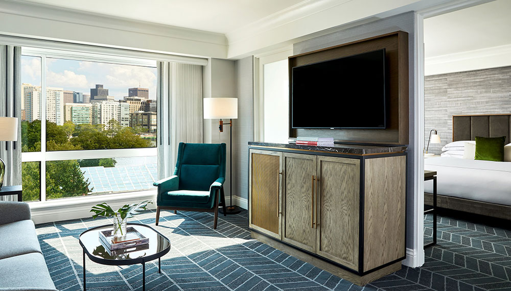 sitting area with views of Cambridge in a Hotel Marlowe suite
